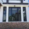UPVC Fixed Windows | Modern House | LuckyHome Philippines Modern house with black-framed UPVC fixed Window-durable, stylish, and energy-efficient by LuckyHome Philippines