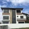 UPVC Fixed Window | Modern House Installation | LuckyHome Philippines Modern three-story house featuring black-framed UPVC fixed windows – durable, sleek, and energy-efficient by LuckyHome Philippines