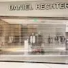 Motorized Transparent Polycarbonate Roll-Up Door for Luxury Retail Stores | LuckyHome PH Elegant motorized transparent polycarbonate roll-up door installed in a luxury retail boutique, providing clear visibility and high security by LuckyHome Philippines.